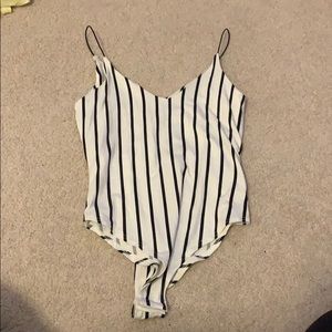 Black and white vertical striped body suit